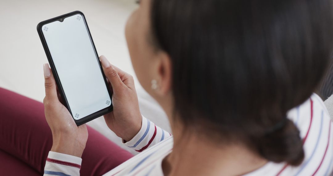 Woman Holding Smartphone with Blank Screen for Mockup - Free Images, Stock Photos and Pictures on Pikwizard.com