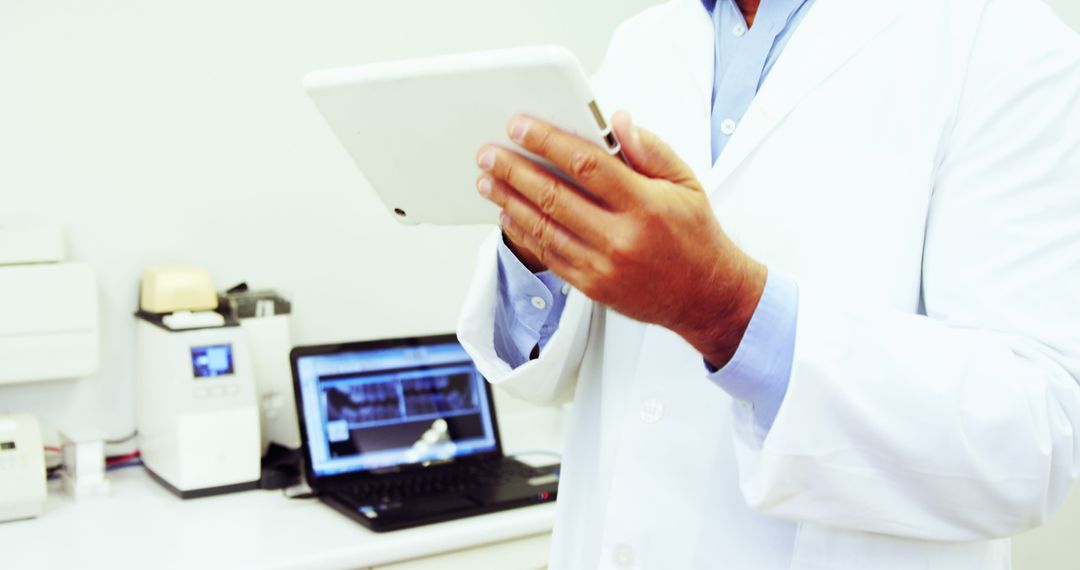 Doctor Using Digital Tablet in Modern Medical Office - Free Images, Stock Photos and Pictures on Pikwizard.com