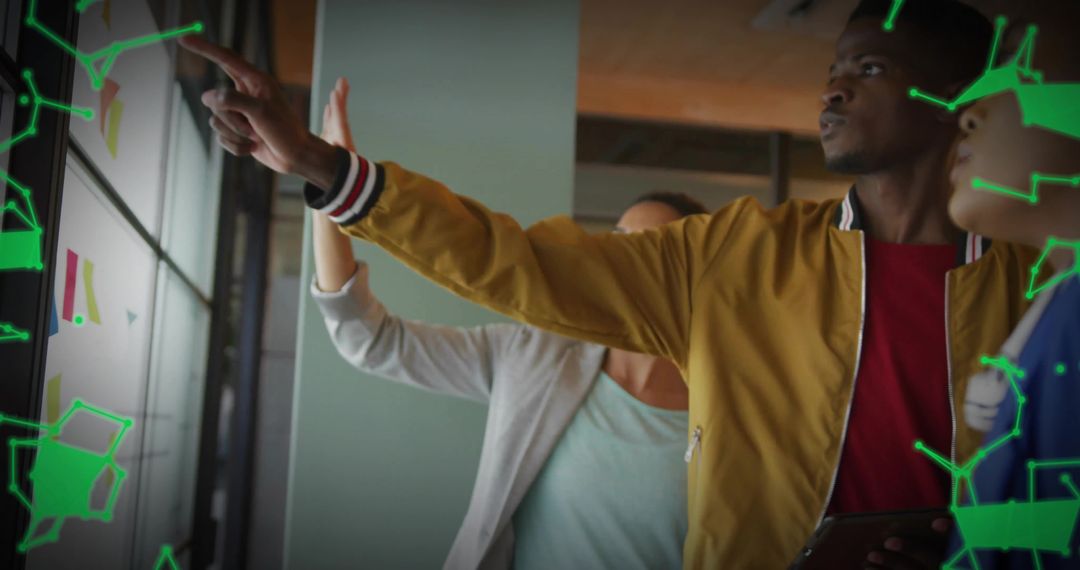 Team Presenting on Glass Wall with Pointing Man in Mustard Jacket and AR Overlays