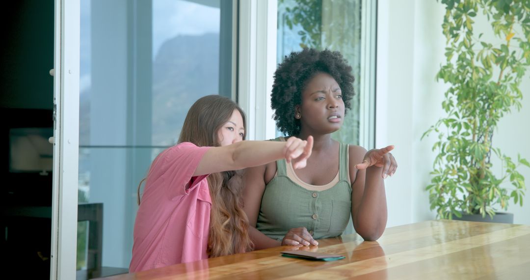 Friends Chatting and Enjoying View on Hotel Balcony