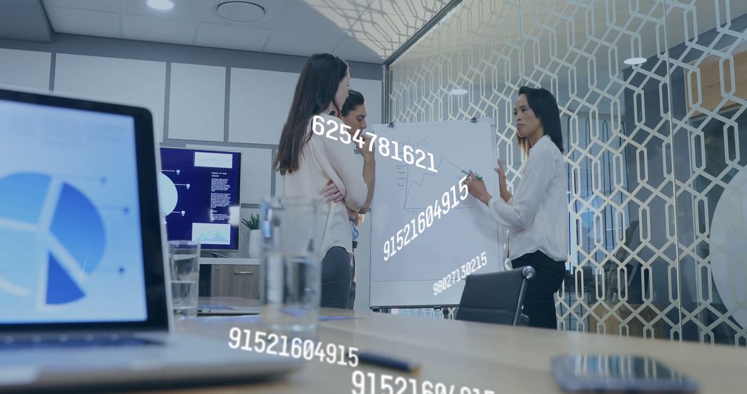 Business Team Analyzing Financial Data on Screen