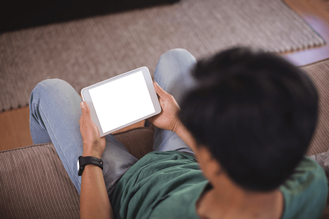 Man Using Transparent Digital Tablet Indoors High Angle