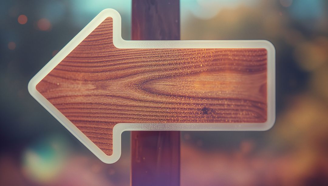 Rustic Wooden Arrow Sign Leading Left Amid Autumn Bokeh Outdoors