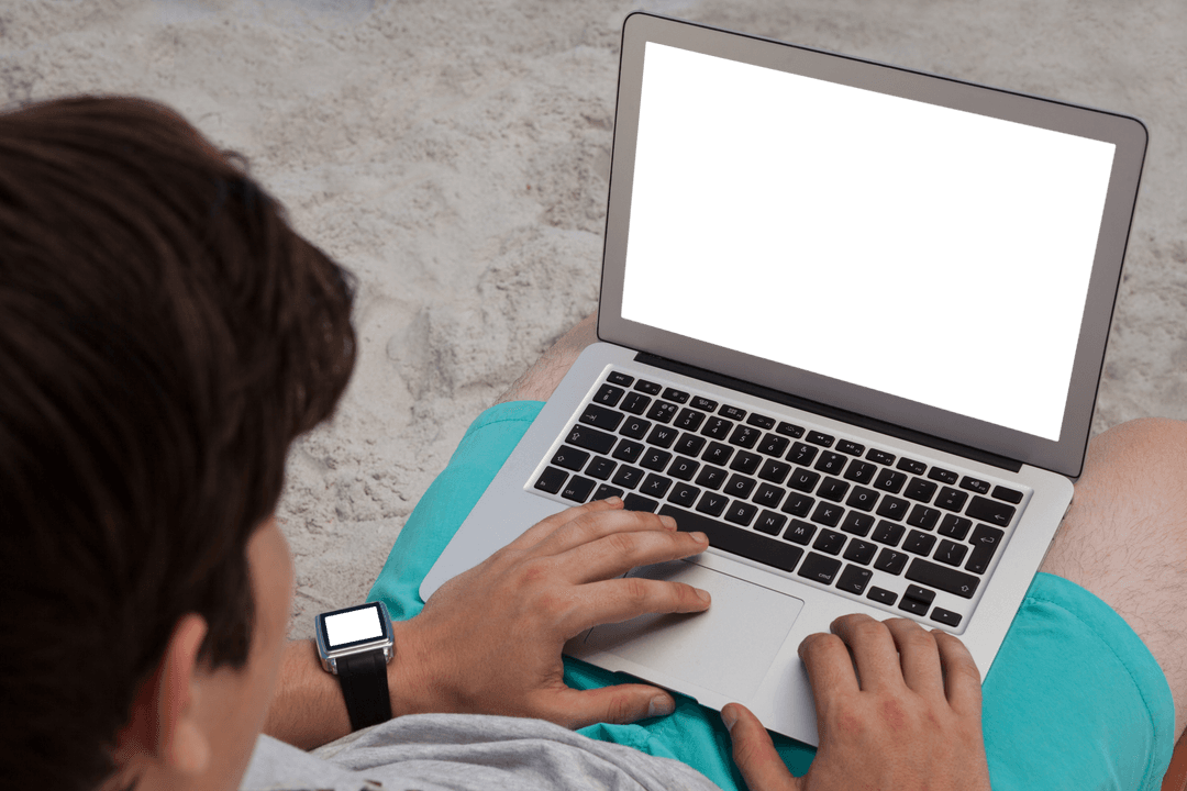 Man Relaxing Using Laptop on Sunny Beach in Shorts
