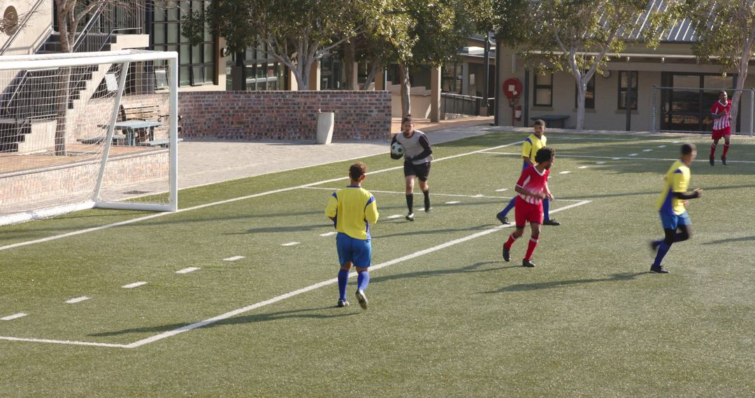Teen Soccer Player Developing Goalkeeping Skills on School Field
