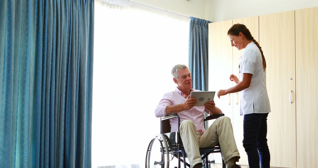 Caregiver Assisting Elderly Man in Wheelchair at Health Facility - Free Images, Stock Photos and Pictures on Pikwizard.com