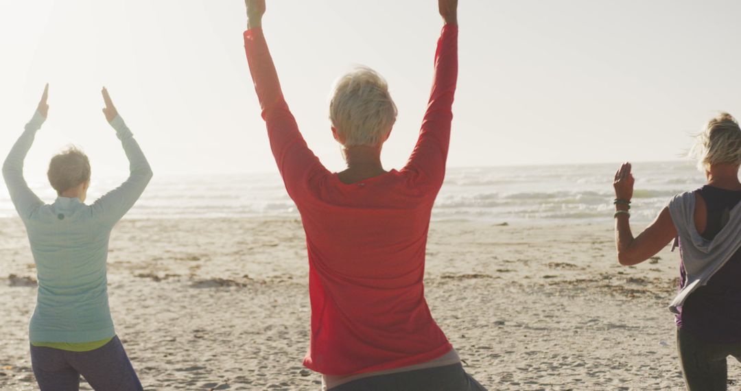 Seniors Practicing Yoga at Peaceful Beach in Morning Sunshine - Free Images, Stock Photos and Pictures on Pikwizard.com