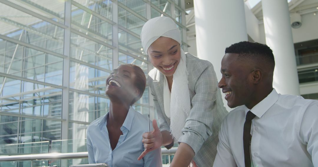 Diverse Team Collaborating in Modern Office with Joyful Interaction