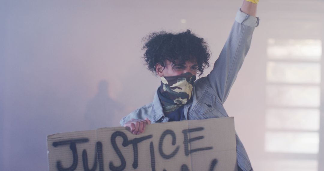 Young Activist Holding Justice Sign During Protest - Free Images, Stock Photos and Pictures on Pikwizard.com