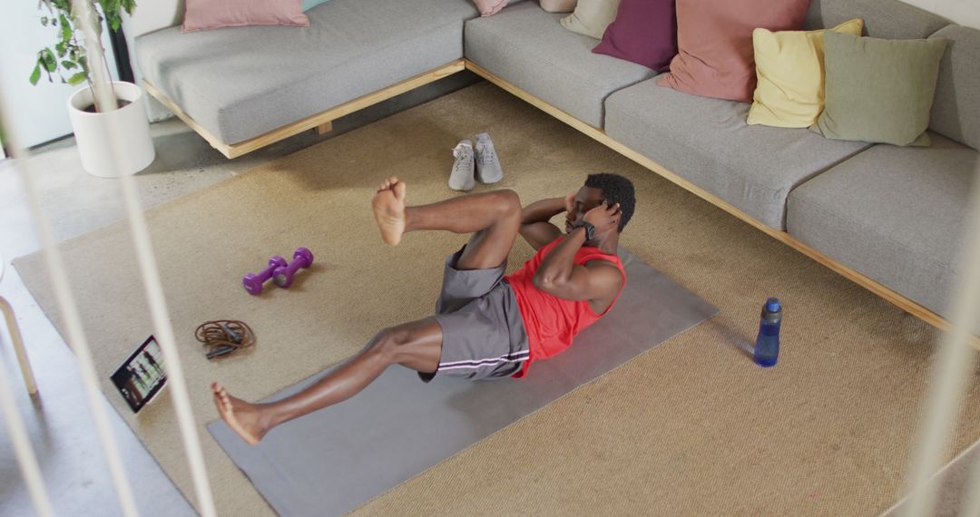 Man Doing Abs Workout on Floor Mat at Home During Exercise Routine - Free Images, Stock Photos and Pictures on Pikwizard.com