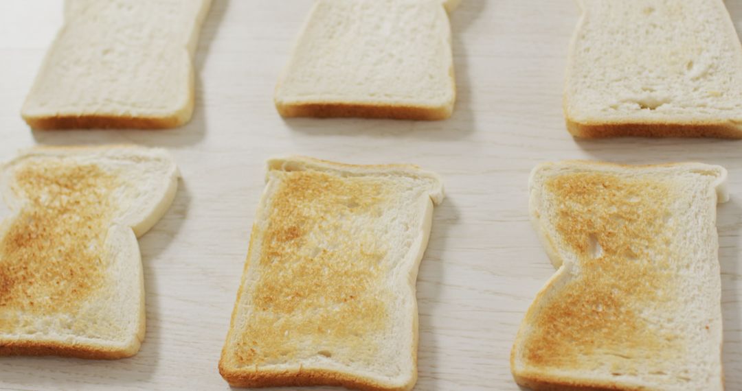 Variety of Toast Levels on Light Wooden Table