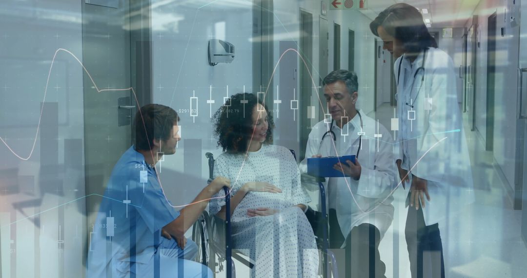 Medical Team Assisting Pregnant Patient in Wheelchair During Consultation