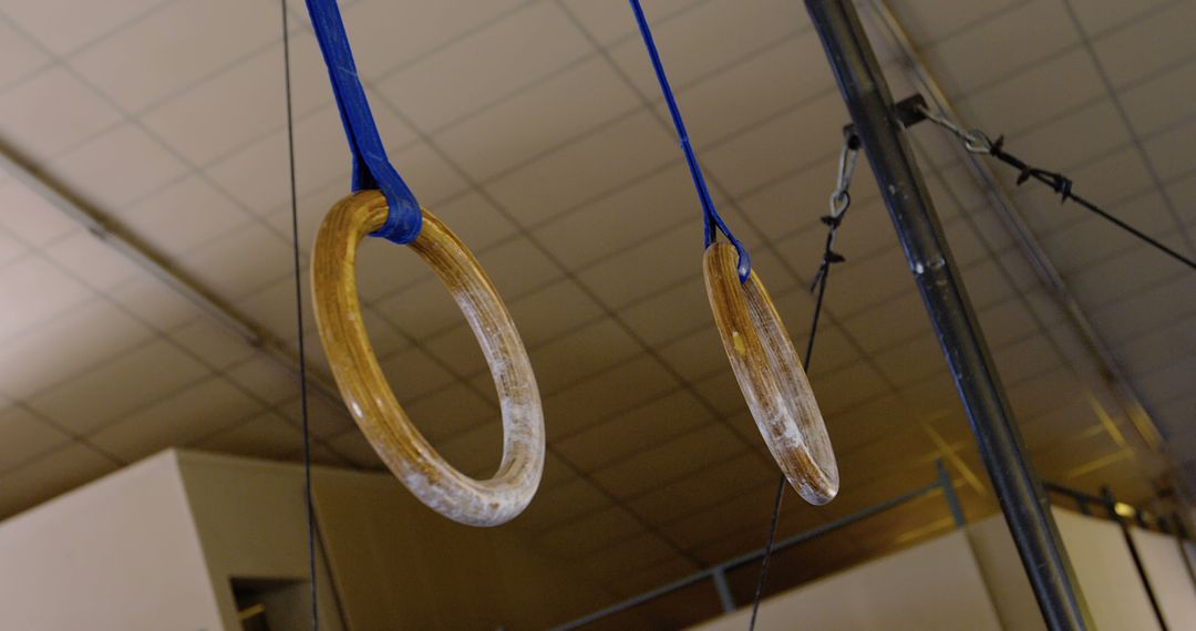 Gymnastic Wood Rings Hanging in Training Facility - Free Images, Stock Photos and Pictures on Pikwizard.com