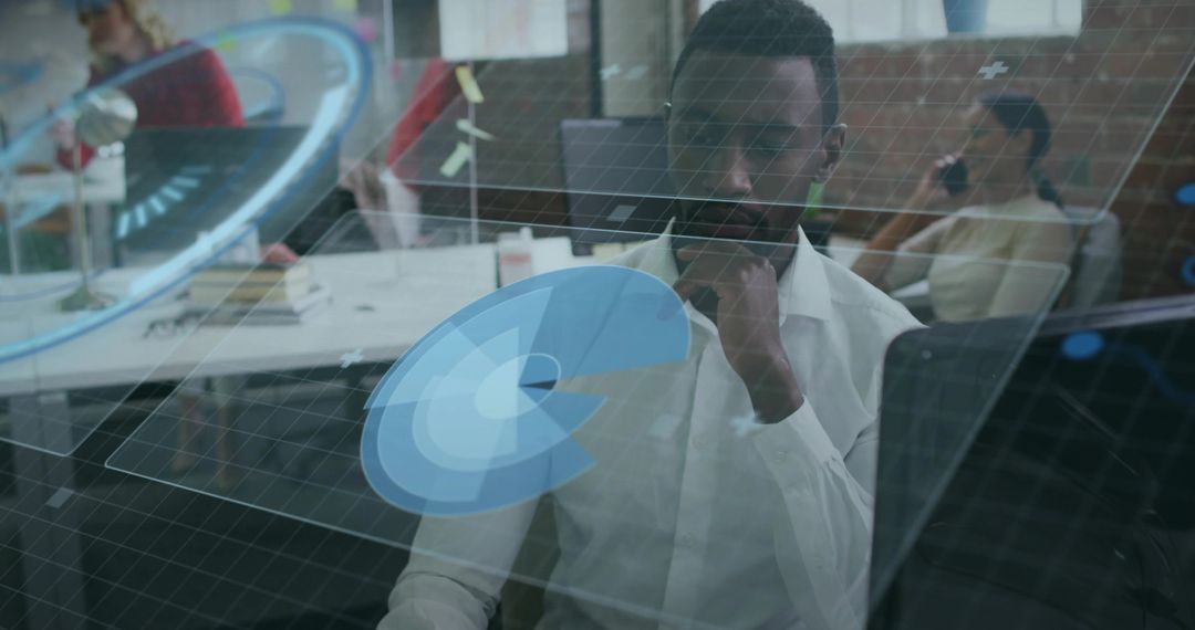 Data Analyst Studying Holographic Charts in Modern Office