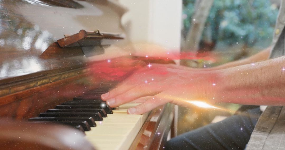 Hands Playing Piano with Magical Light Effects