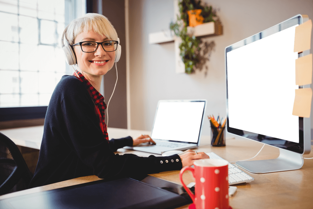 Smiling Graphic Designer with Headphones and Transparent Screens