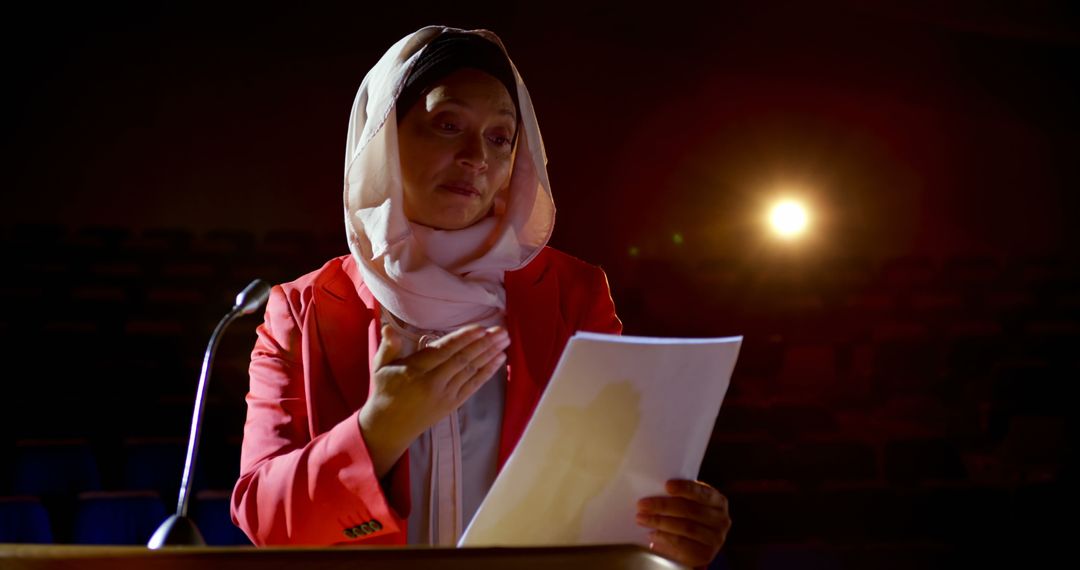 Businesswoman in Hijab Delivering Speech on Stage