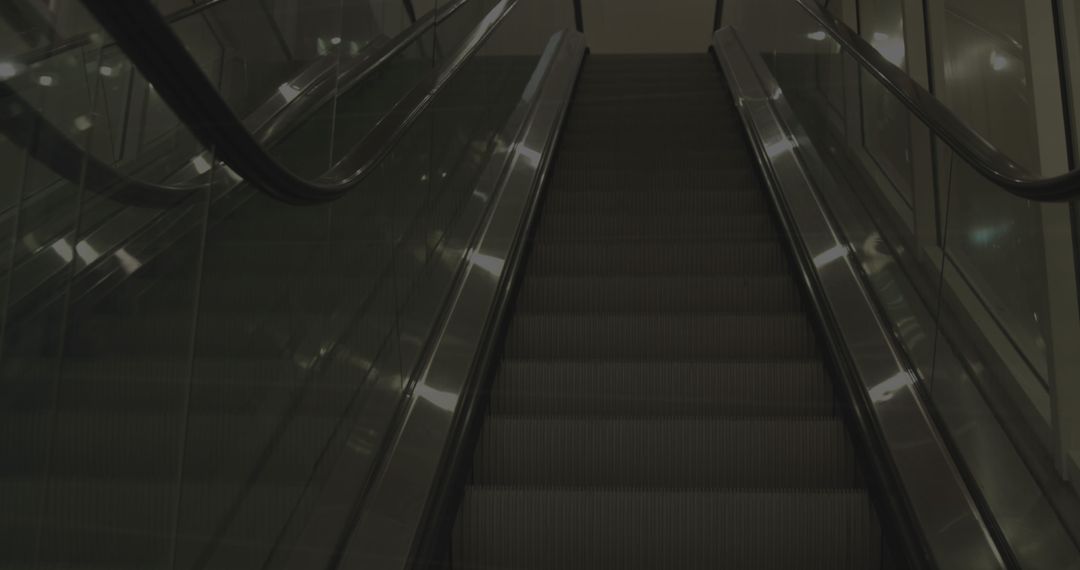 Empty Escalator in Modern Shopping Mall at Night