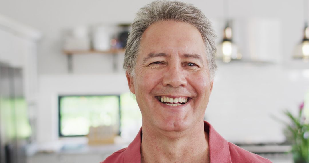 Smiling Mature Man in Modern Kitchen - Free Images, Stock Photos and Pictures on Pikwizard.com