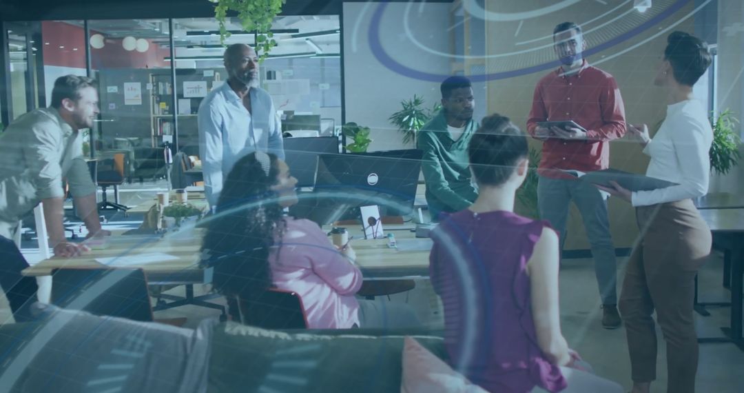 Diverse Team Engaged in Technology-Driven Business Meeting in Modern Office