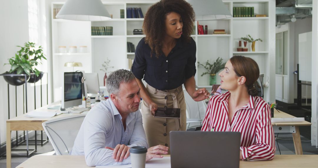 Diverse Team of Professionals Collaborating in Modern Office