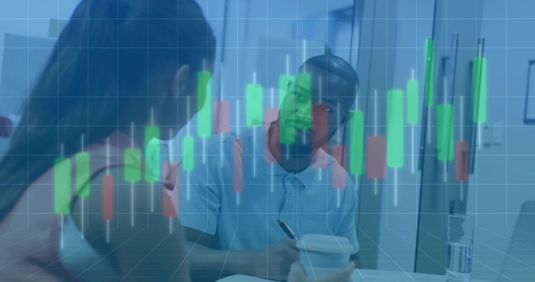 Coworkers Analyzing Financial Chart in Office Environment