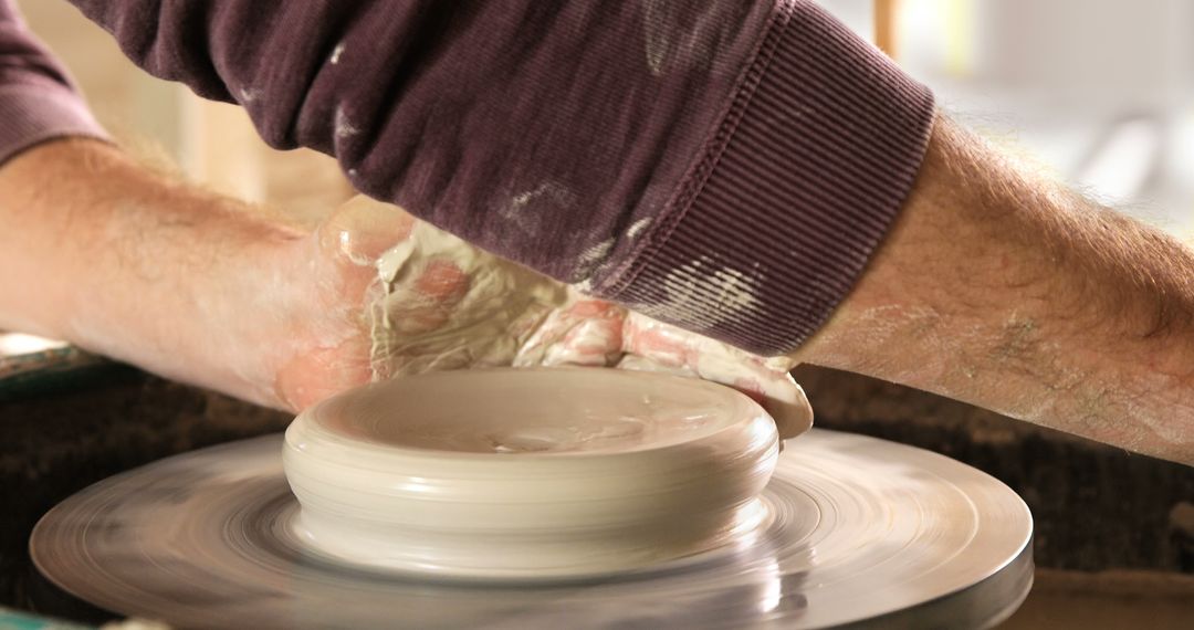 Close-Up of Potter Shaping Clay on Spinning Wheel - Free Images, Stock Photos and Pictures on Pikwizard.com