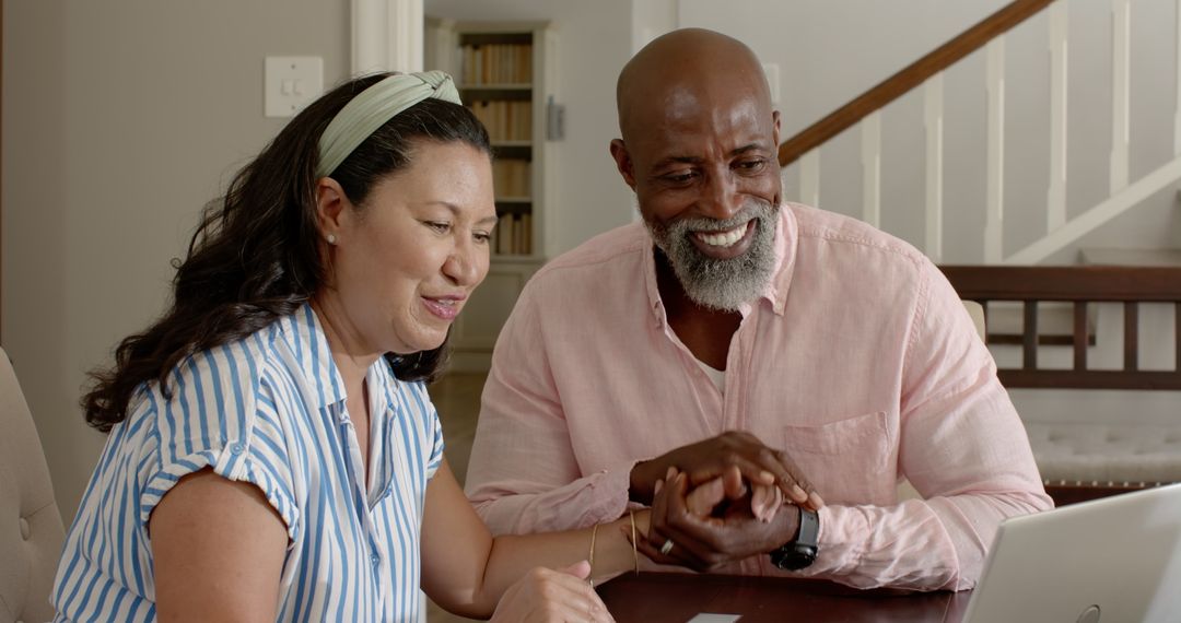 Diverse Senior Couple Connected via Technology at Home
