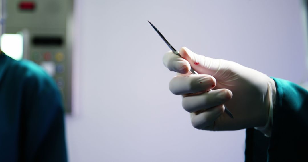 Close-Up of Surgeon Holding Surgical Scalpel in Operation Room - Free Images, Stock Photos and Pictures on Pikwizard.com