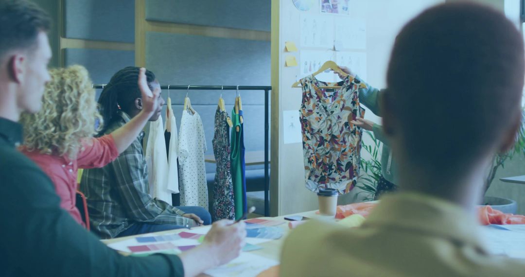 Diverse Team Discussing Fashion Design in Creative Workspace