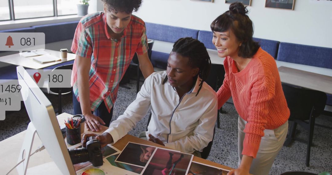 Creative Team Collaborating in Modern Office with Digital Alerts