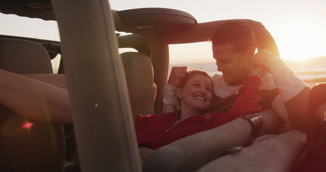 Couple Relaxing in Convertible at Sunset by the Beach - Free Images, Stock Photos and Pictures on Pikwizard.com