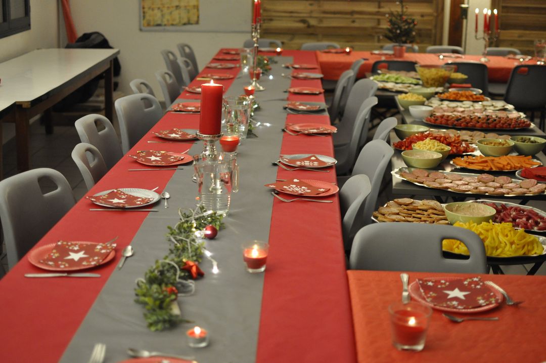 Festively Decorated Long Dinner Table at Christmas Event - Free Images, Stock Photos and Pictures on Pikwizard.com