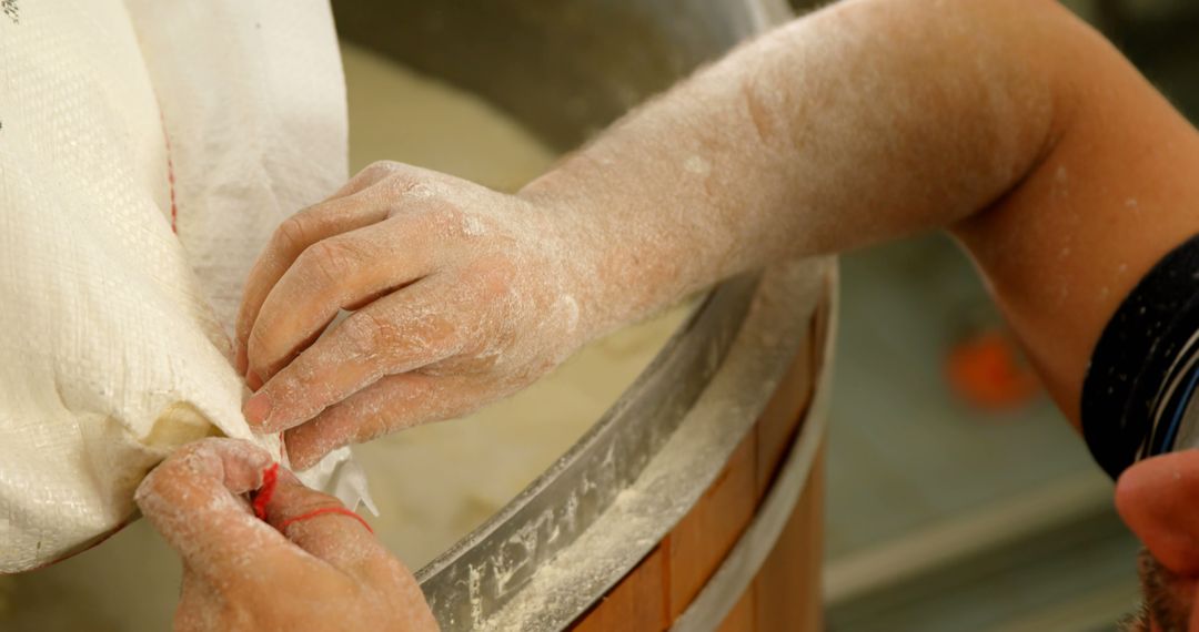 Baker Pouring Flour into Mixing Bowl for Dough Preparation - Free Images, Stock Photos and Pictures on Pikwizard.com