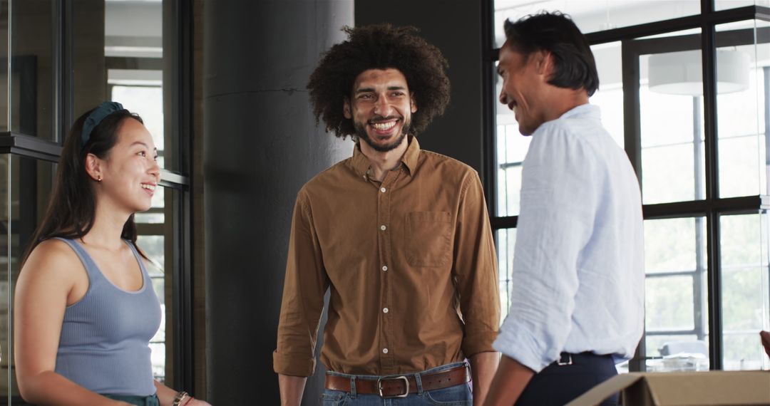 Diverse Colleagues Laughing and Connecting in Modern Office