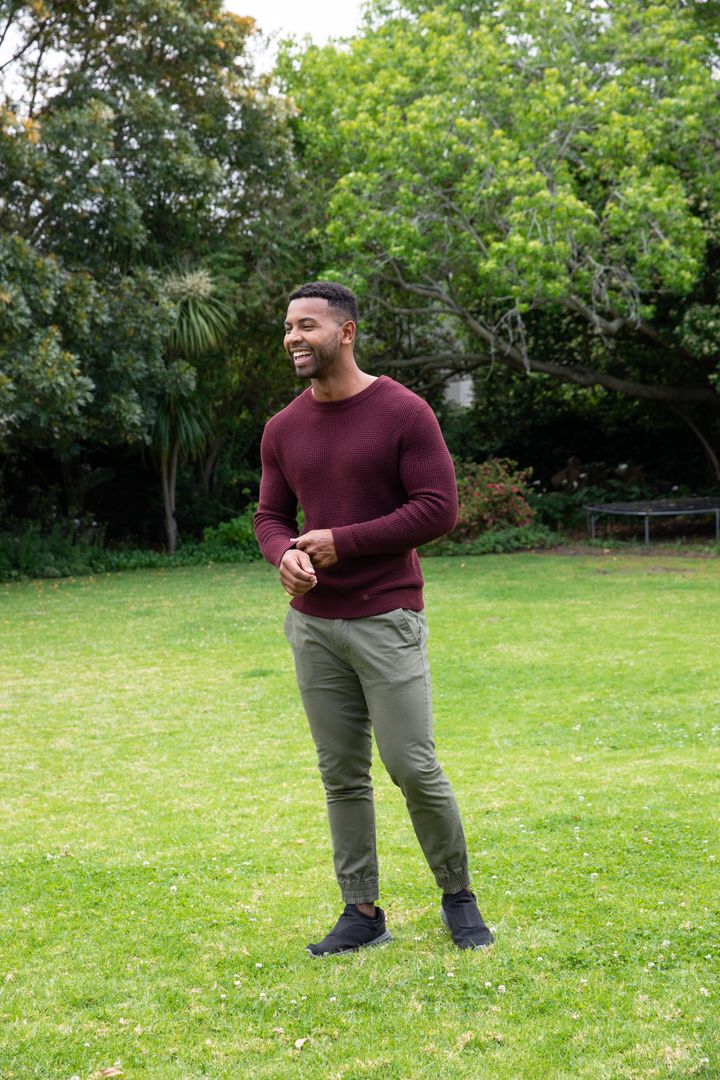 Man Enjoying Relaxing Moment in Lush Backyard Environment