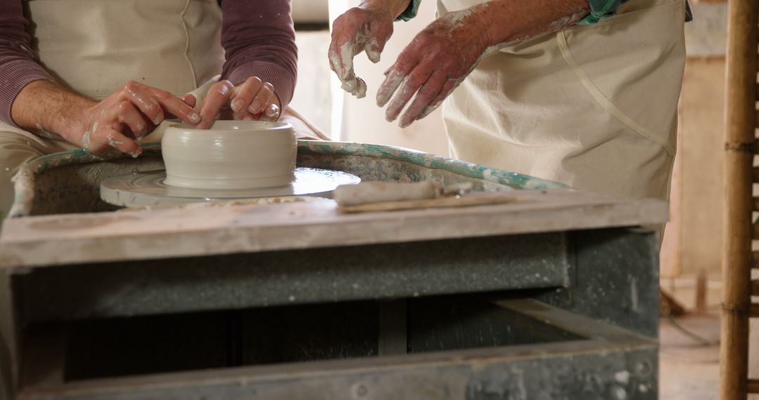 Hands Sculpting Clay on Pottery Wheel in Studio - Free Images, Stock Photos and Pictures on Pikwizard.com