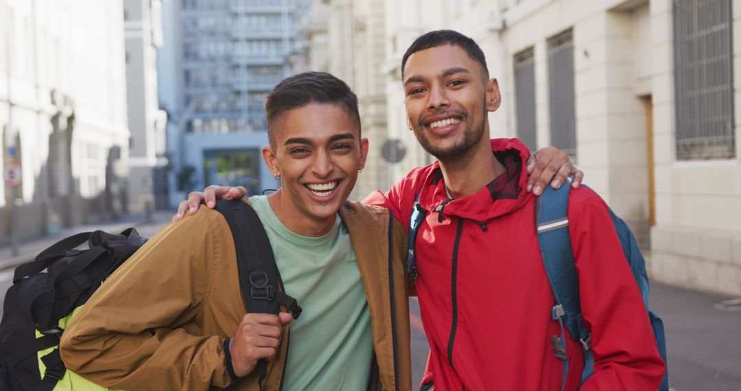 Happy Biracial Couple Embracing During Backpacking Adventure in Urban Environment