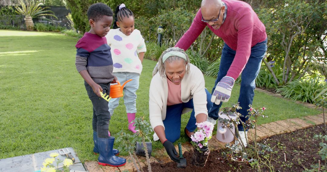 Grandparents and Children Planting Flowers in Garden - Free Images, Stock Photos and Pictures on Pikwizard.com