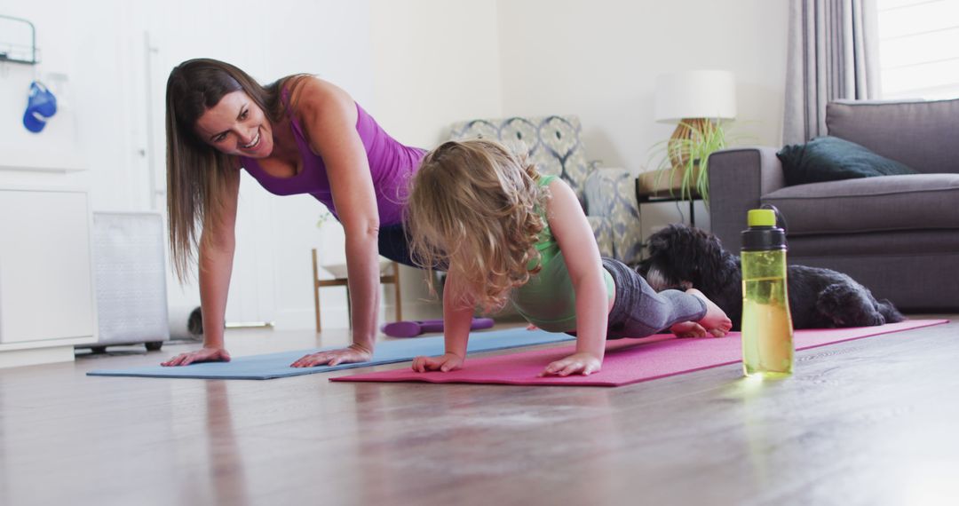 Mother and Daughter Doing Yoga at Home with Their Pet Dog - Free Images, Stock Photos and Pictures on Pikwizard.com