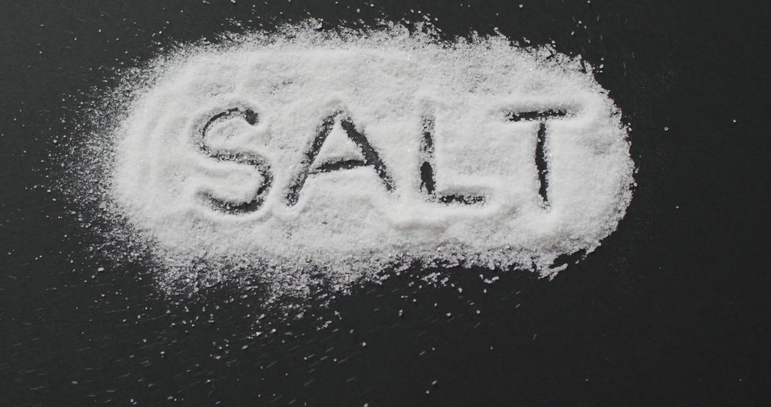 Salt Text Displayed on Black Surface Emphasizes Cooking and Ingredients