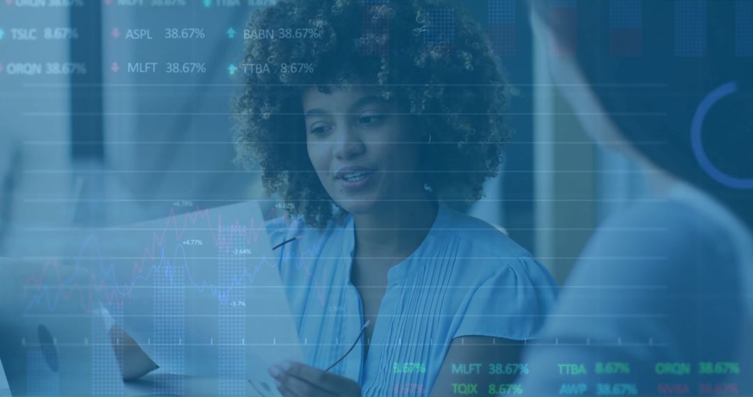 Diverse Business Team Analyzing Financial Data on Overlay