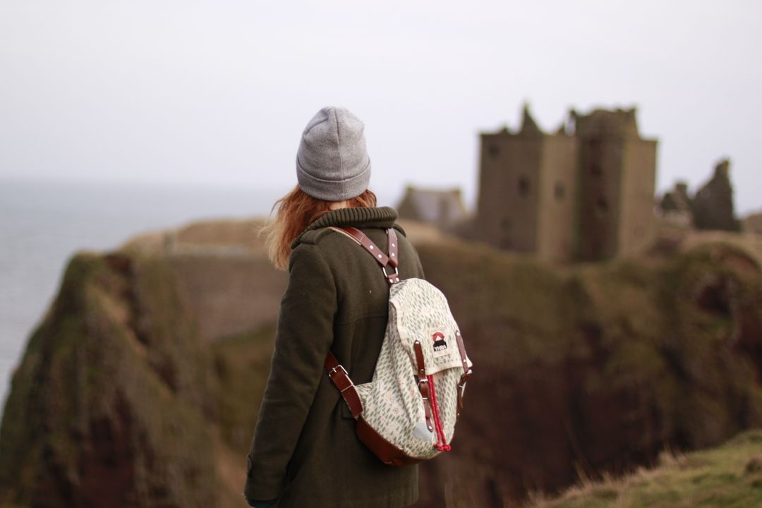 Woman Exploring Coastal Cliff Ruins - Free Images, Stock Photos and Pictures on Pikwizard.com