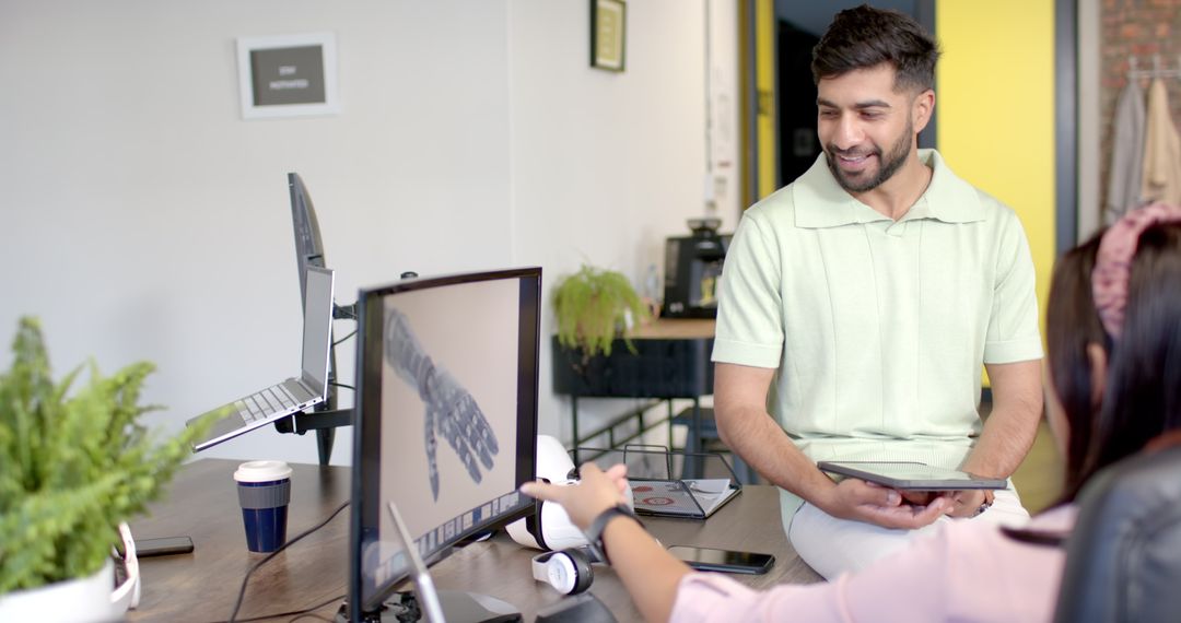 Engineer Discussing Robotic Design in Modern Office Environment