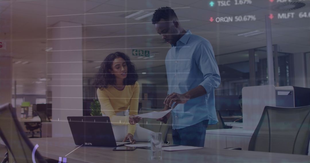 Team Reviewing Stock Market Data in Office Setting