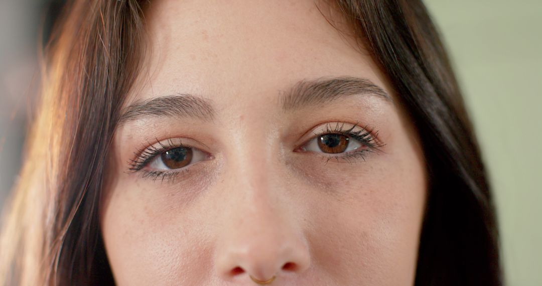 Close-up Portrait Highlighting Brown Eyes and Natural Makeup - Free Images, Stock Photos and Pictures on Pikwizard.com