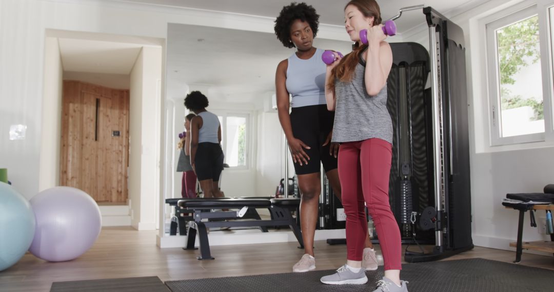 Personal Fitness Training Session with Dumbbells in Modern Gym