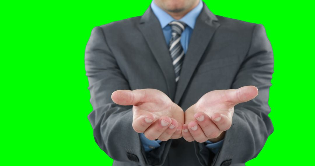 Businessman Offering Open Hands in Green Screen Background - Free Images, Stock Photos and Pictures on Pikwizard.com