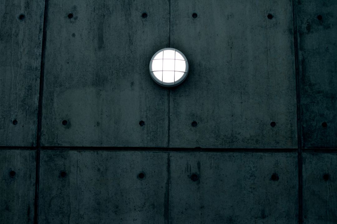 Minimalist Concrete Wall with Illuminated Round Light Fixture - Free Images, Stock Photos and Pictures on Pikwizard.com