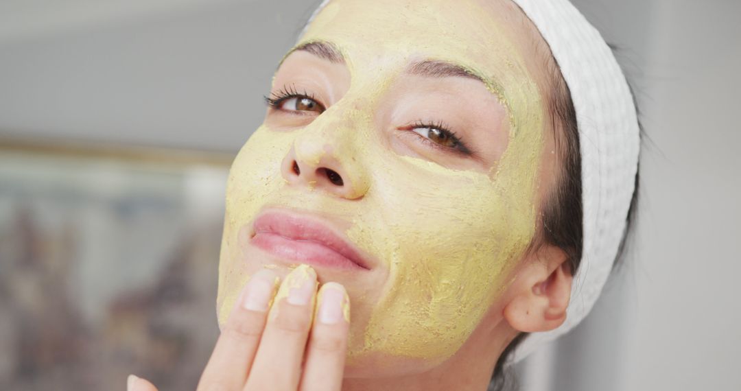 Woman Applying Natural Face Mask, Enjoying Skincare Routine at Home - Free Images, Stock Photos and Pictures on Pikwizard.com